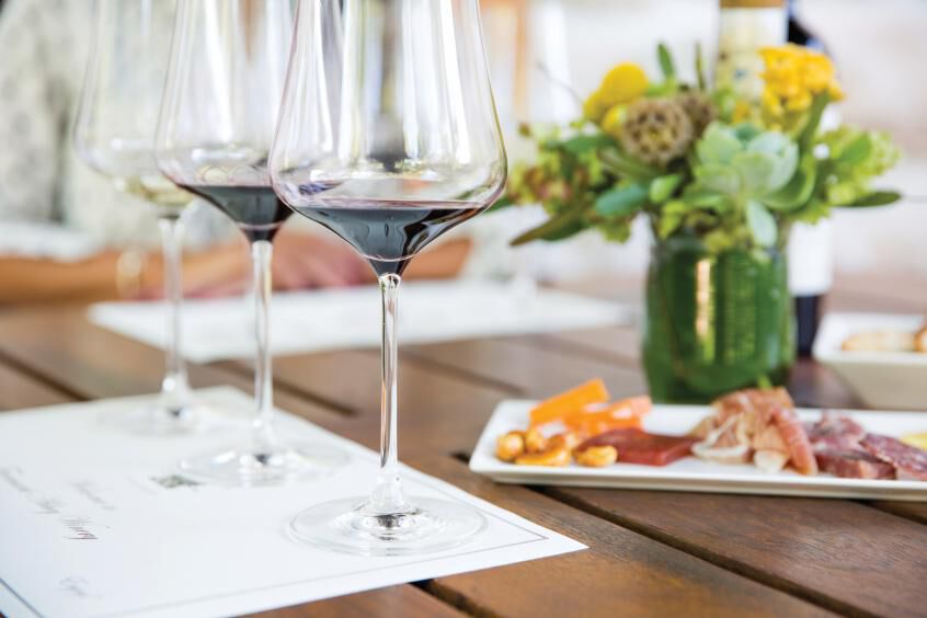 Two glasses of red wine with charcuterie