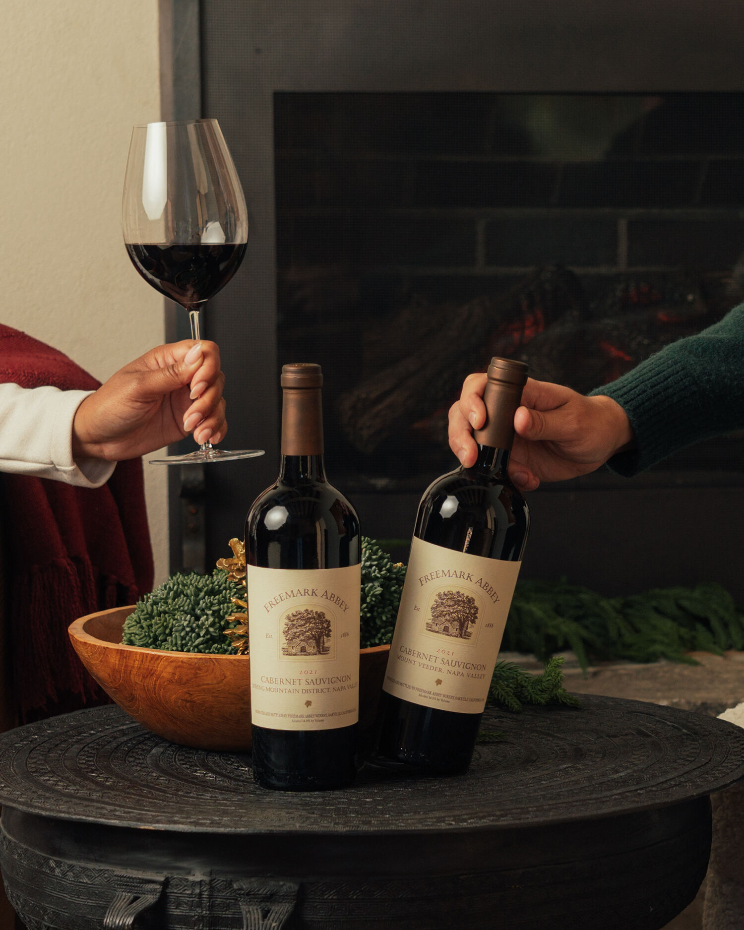 Freemark Abbey wines enjoyed by a fireplace