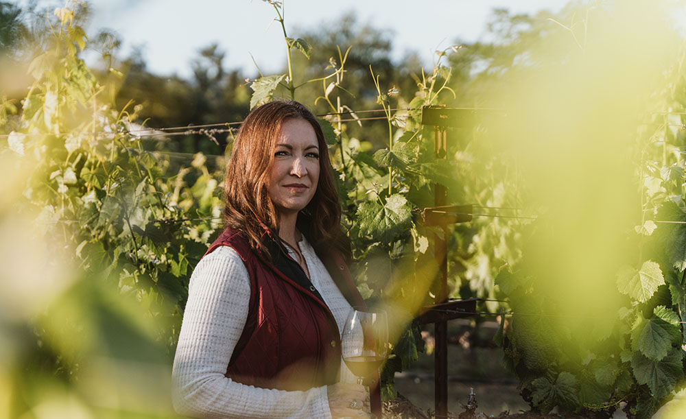 Kristy Melton in a vineyard 