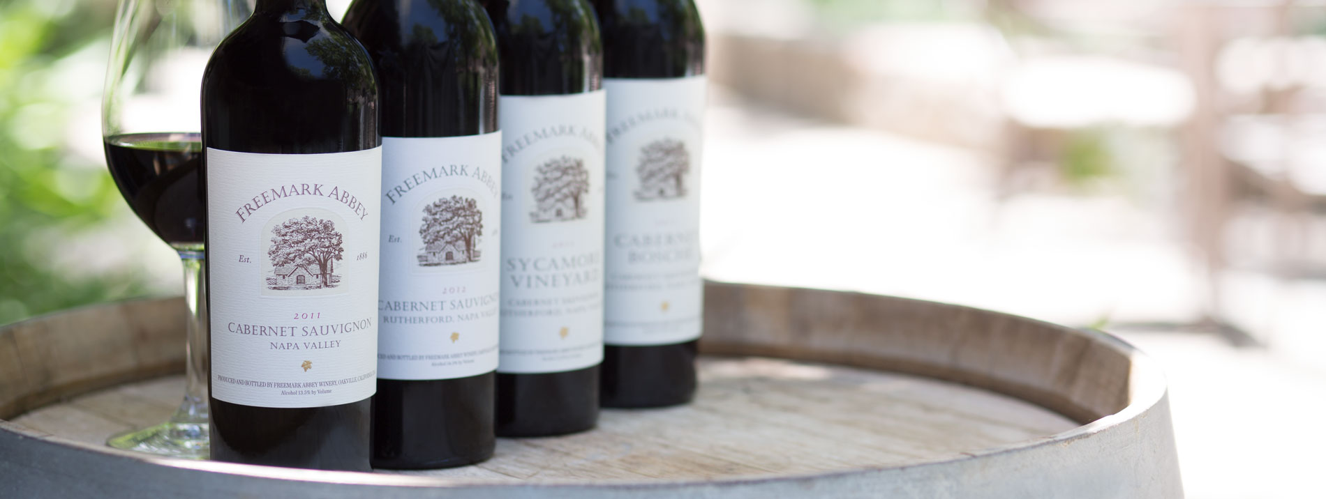 A selection of wine from Freemark Abbey on a barrel