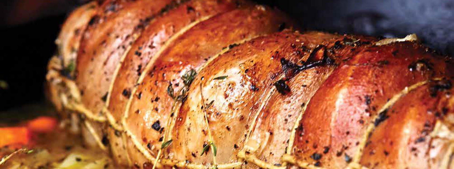 Roast lamb in twine with herbs