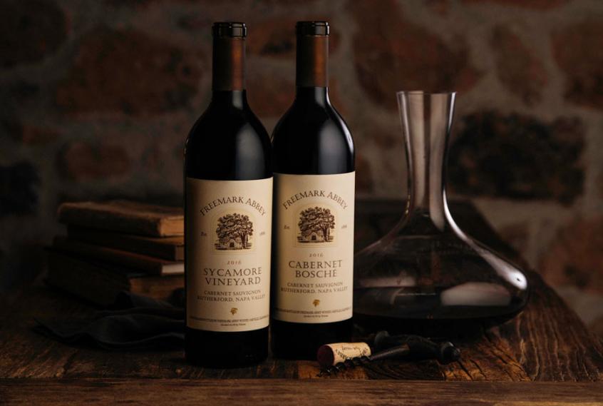 Sycamore and Bosché bottles on a table next to a decanter