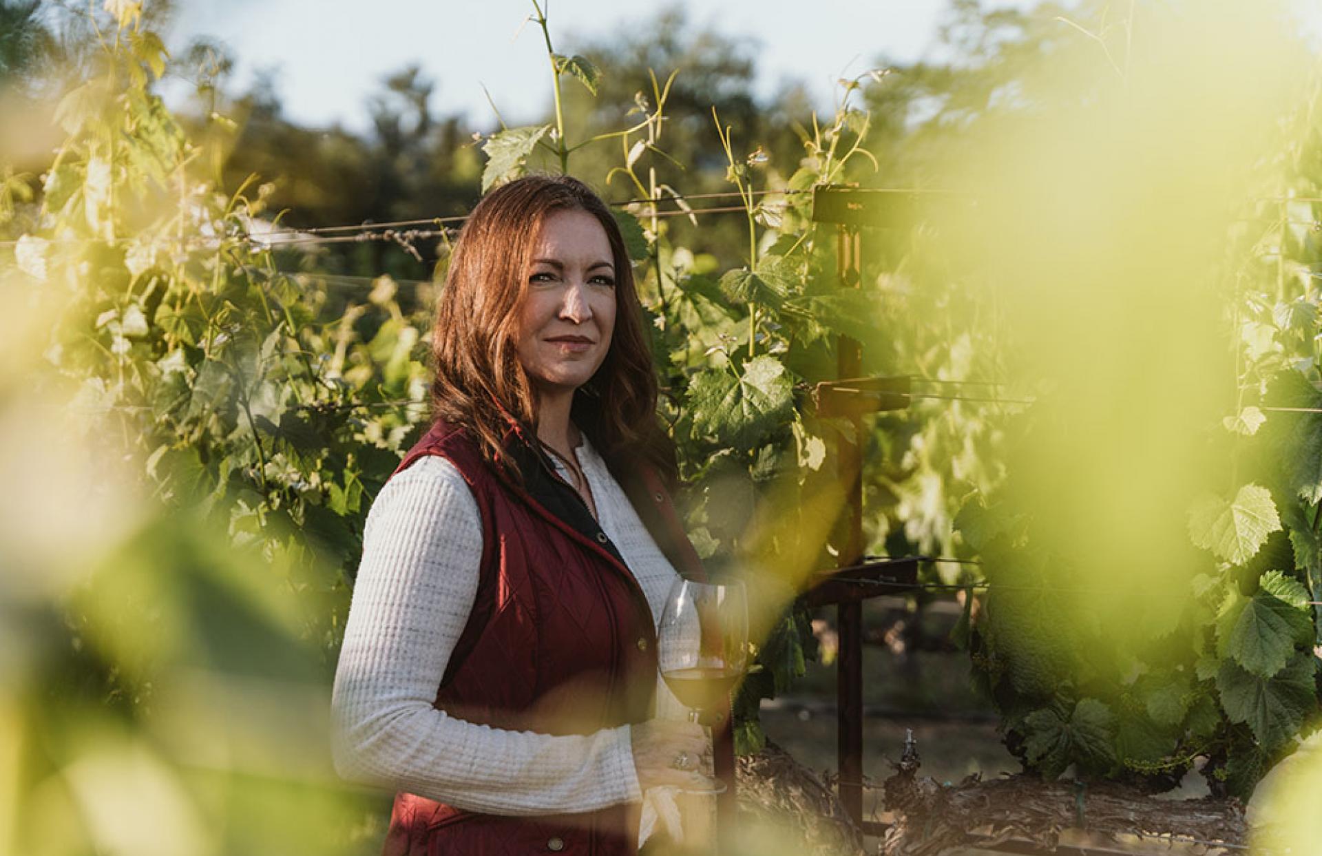 Kristy Melton among the vines at Freemark Abbey Winery